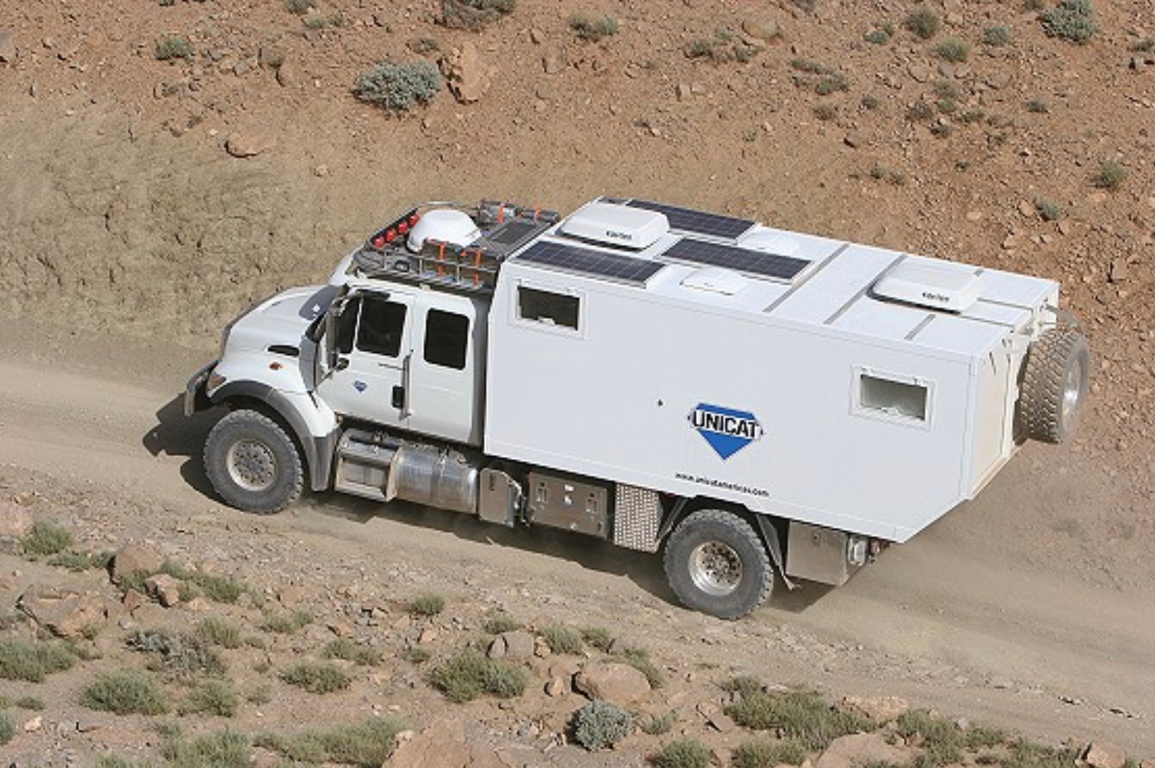 UNICAT expedition vehicle in desert rock country