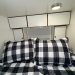 Bed Area Showing Window Cabinets And Bed
